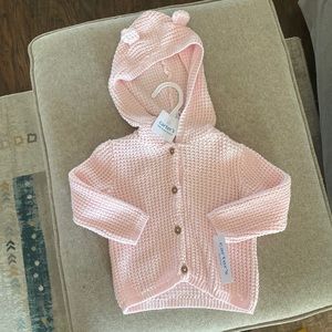 Carter’s pink cardigan with hood. Hood has bear ears on them.Size 9 months.